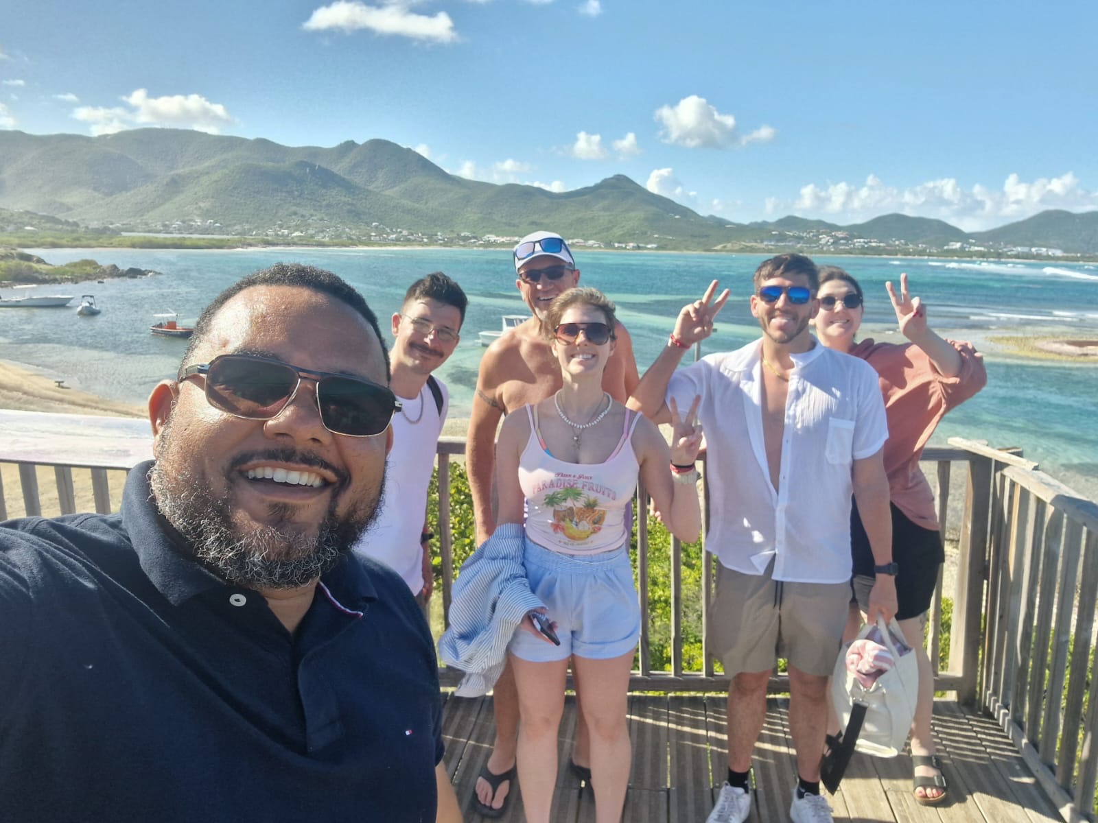 Group selfie at the Orient Bay lookout over Pinel Island with your guide.